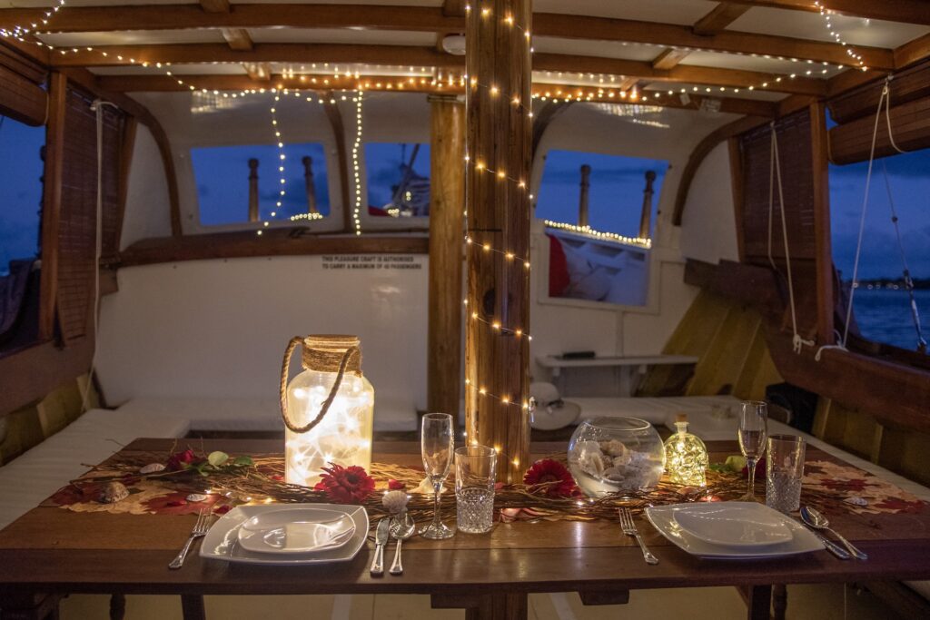 Couple aboard the boat at golden hour